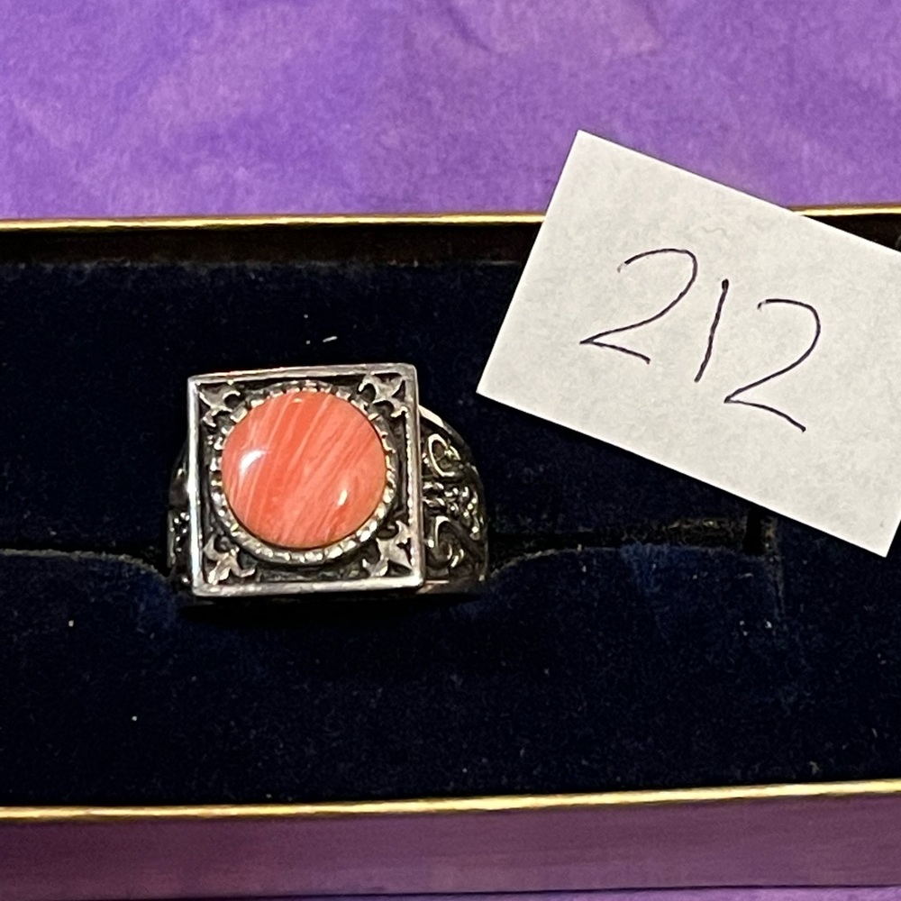Sterling silver and pink stone.